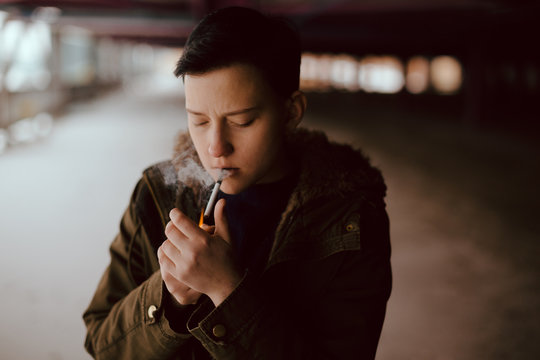 Real lesbian girl smoking on the parking area