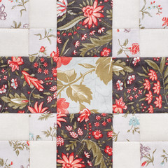Pastel geometric patchwork block from pieces of fabrics, detail of quilt