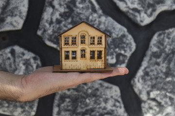 Real estate and mortgage investment. House on the hand.