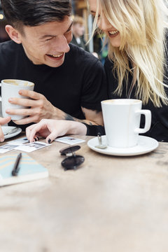 Young Couple at the Coffee Shop Drinking a Cappuccino