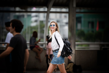 Fototapeta premium young woman walking on the street in paris