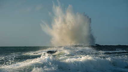 Waves crashing on rocks.