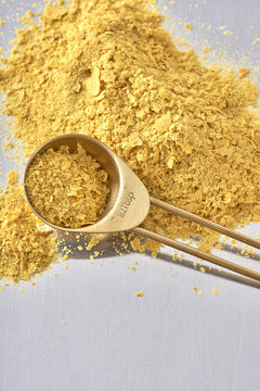 Nutrional Yeast, Used in Vegan and Dairy-Free Cooking as a replacement for cheese/dairy flavor.