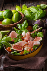 Homemade fresh figs salad with herbs and roasted garlic toast