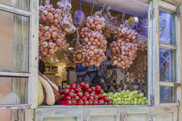 Greek vegetables on display in a tavern window