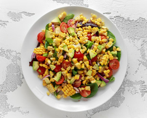 Sweet Corn salad with tomatoes, avocado, red onion, herbs and lime