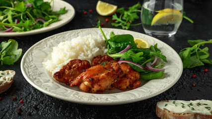 Roasted boneless skinless chicken thighs with rice and green vegetables mix