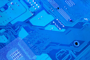 Computer motherboard. Tracks on the printed circuit board. Electronic components. Resistor,...