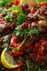 Lentil salad with roasted red pepper, zucchini and dry tomatoes, lemon. healthy food, vegetarian and vegan style