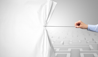 Hand pulling paper curtain, changing scene concept
