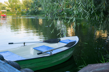 Naklejka na ściany i meble boat with oars