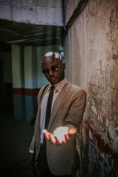 African American Businessman catching light with hand