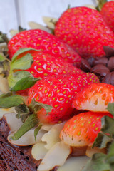 Delicious homemade brownie cake with strawberries. Selective focus
