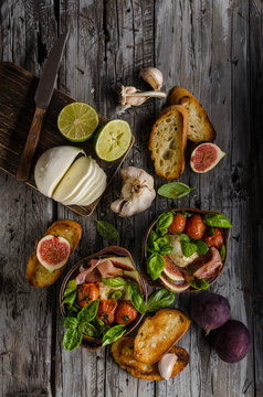 Homemade fresh figs salad with herbs and roasted garlic toast