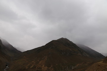 View of single mountain under dark cloud