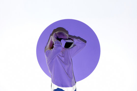 Woman with projection of violet circle