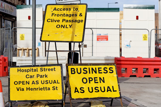 Business Open As Usual, Access to Frontages and Clive Passage Only UK yellow roadworks signs