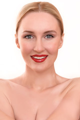 Obraz premium Beautiful blonde woman with pretty blue eyes and red lips. A scary female in pain holding her head and screaming in anger with an open mouth on her menstrual cycle period pain
