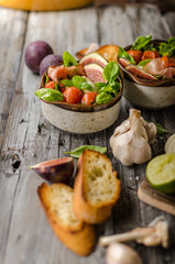 Homemade fresh figs salad with herbs and roasted garlic toast