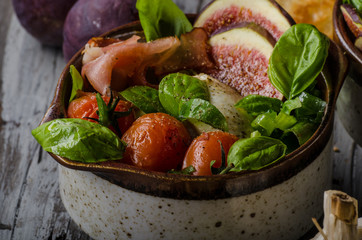 Homemade fresh figs salad with herbs and roasted garlic toast