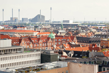 Urban cityscape of Copenhagen with modern and historical buildings, Denmark. Top view on danish capital