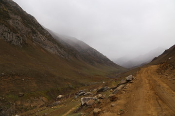 Half view of moutains with clouds