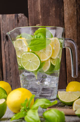 Lime lemons limonade, fresh herbs and ice in