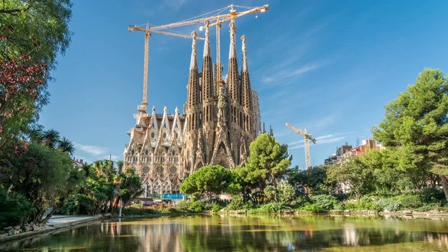 The Sagrada Familia, a large unfinished Roman Catholic church in Barcelona, designed by famous Catalan architect Antoni Gaudi. Blue sky, sunny summer day.
