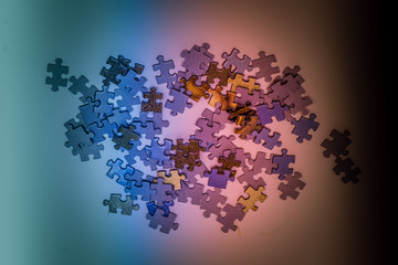Fototapeta premium Selective focus of pieces puzzle jigsaw, puzzle background. Jigsaw puzzle color background.