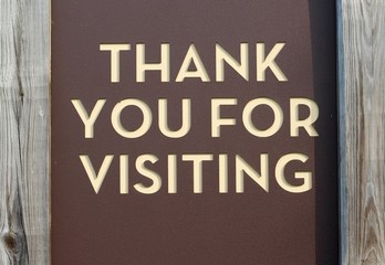 The brown park sign on a close up view.