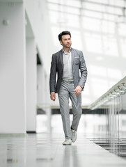 Fototapeta premium business man walking in the business center