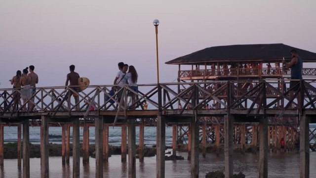 People walking the boardwalk at Cloud9