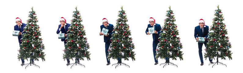Businessman decorating christmas tree isolated on white