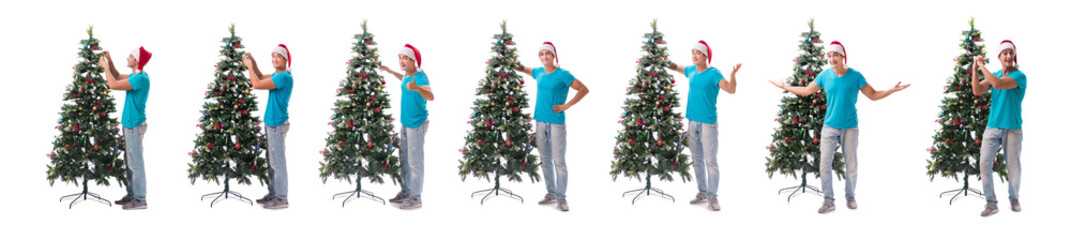 Young man decorating christmas tree isolated on white