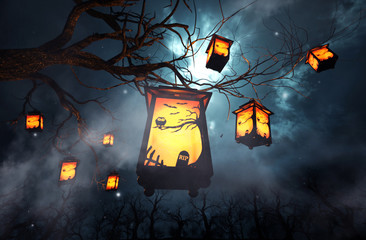 Halloween caged candles hanging on branch of the tree,3d illustration