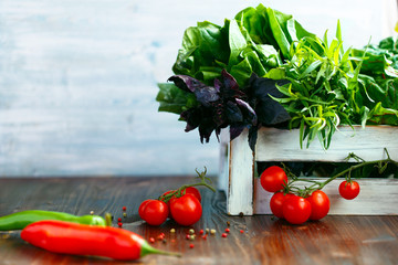 Cherry, tarragon, chili pepper, basil, spices Ingredients for cooking pasta. Food background on a wooden table