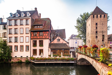 Fototapeta na wymiar View of beautiful half-timbered houses and canal seen from Strasbourg France