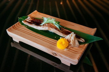 Premium Unagi sushi on wood plate, whole large piece Japanese Unagi eel sushi