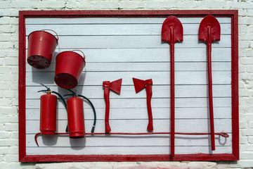 stand on the wall of the building, with the equipment necessary in case you need to extinguish the...