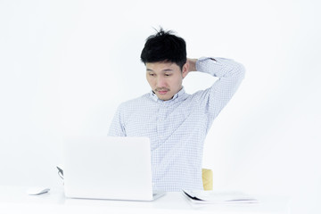 Asian employee salary man sitting at desk and working with lazy and sleepy, isolated on white background.