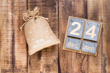 Christmas greeting card wooden background.