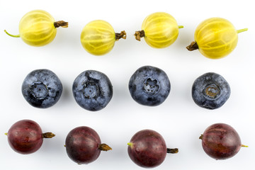Berries of blueberries,  yellow and red gooseberry isolated on a white background.
