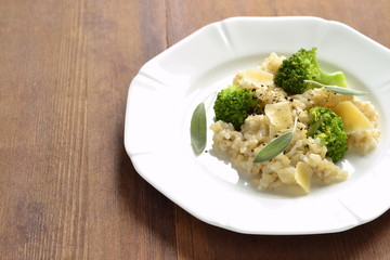 Brown rice with broccoli and parmesan cheese, copy space