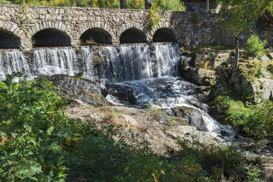 Stone Bridge With Waterfall