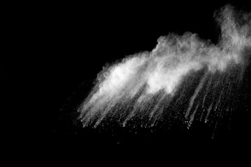 Explosion of white dust on black background.