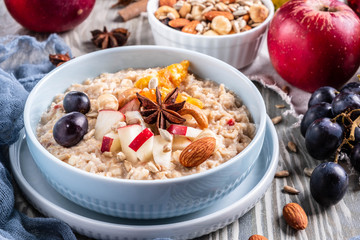 oatmeal with fruit and nuts, healthy breakfast, closeup