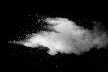 Explosion of white dust on black background.