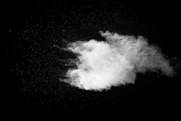 Explosion of white dust on black background.