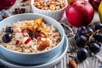 oatmeal with fruit and nuts, healthy breakfast, closeup
