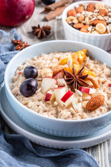 oatmeal with fruit and nuts, healthy breakfast, closeup